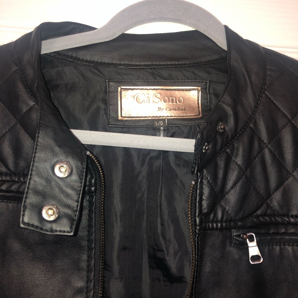 a trendy black pleather jacket with silver zippers